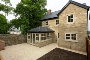 Extension constructed by Cussins featuring Liniar casement windows and French doors in cream