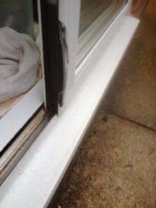 Image of the door a burglar attempted to break into with a broken edge
