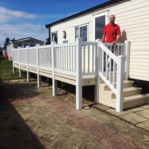 Dimension Sundecks employee standing on a finished uPVC deck