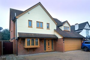 Full home featuring fully foiled windows, front door and garage door 