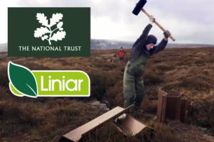 Man in coveralls hammering plastic piling into the moors, national trust logo, liniar logo