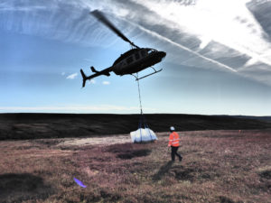 Liniar's plastic piling being delivered via helicopter to the top of the moors in Derbyshire