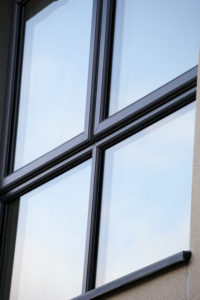 Up close image of 7016 Grey foiled casement windows