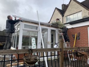 Horton's Building Plastics erecting a conservatory for a little girl 