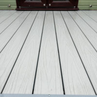 Up close image of the Agate Grey, Woodgrain embossed SwitchBoard decking from GG Leisure