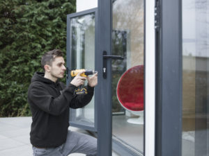 Chris Armes installing an Alumina door